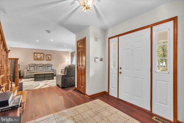 entrance foyer featuring dark hardwood / wood-style flooring