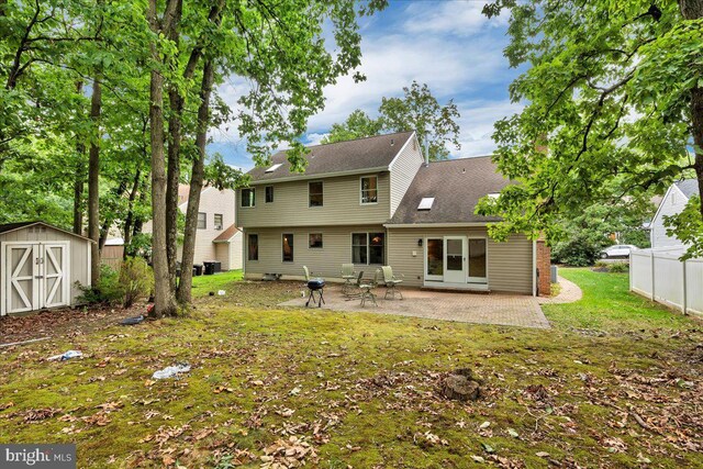 8 Annapolis Dr, Sicklerville, NJ 08081 - rear view of property with an outbuilding, a storage unit, fence, a yard, and a patio area