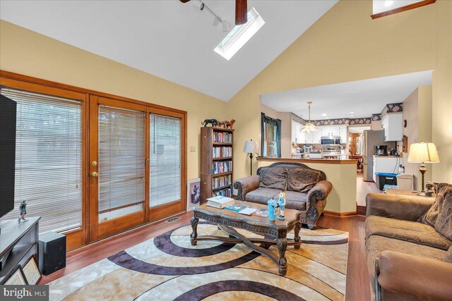 8 Annapolis Dr, Sicklerville, NJ 08081 - living room with high vaulted ceiling, a healthy amount of sunlight, visible vents, and light wood-style flooring