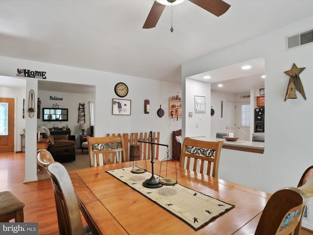 dining space with plenty of natural light, ceiling fan, and light wood-type flooring