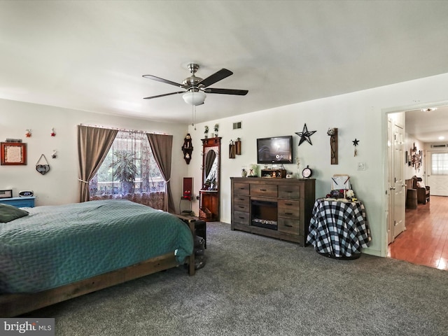 bedroom featuring ceiling fan and wood-type flooring