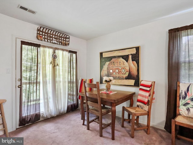 dining space featuring carpet flooring