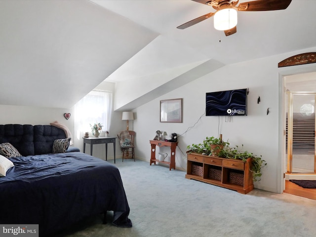 bedroom featuring lofted ceiling, ceiling fan, and carpet