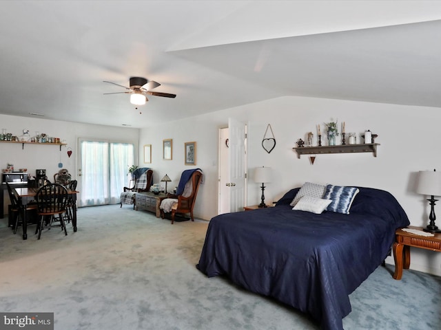 carpeted bedroom with lofted ceiling and ceiling fan