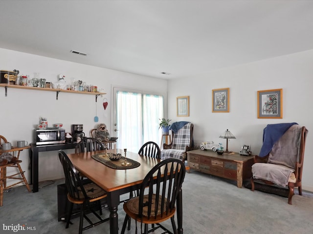 view of carpeted dining area