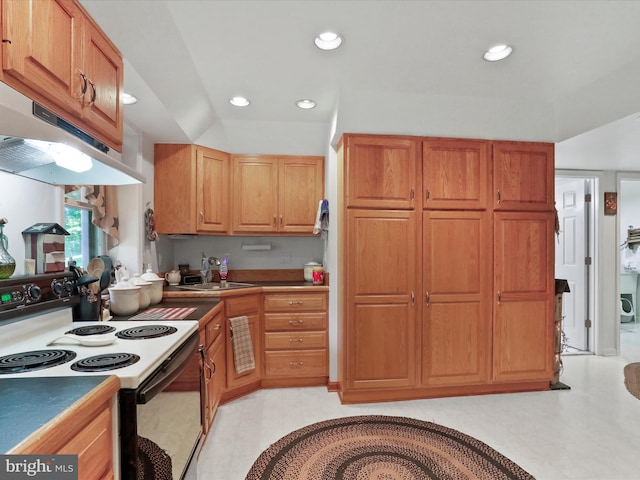 kitchen featuring white range with electric stovetop and sink