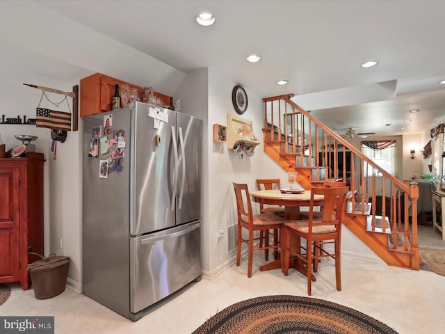 kitchen with stainless steel refrigerator and ceiling fan