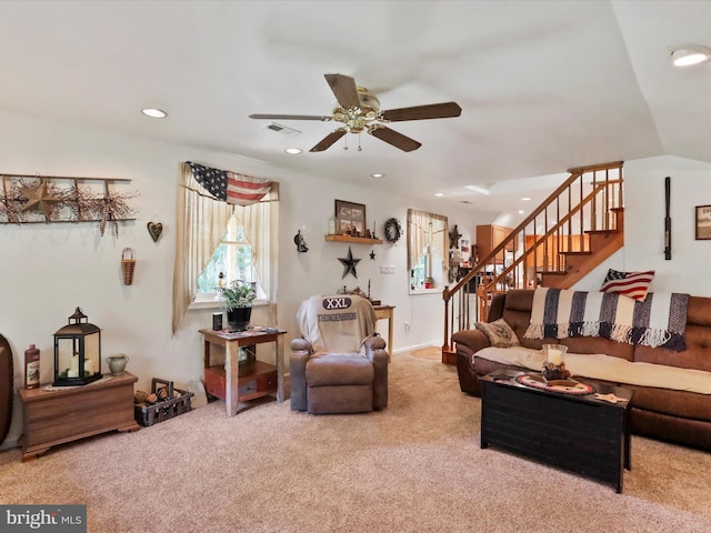 living room featuring lofted ceiling, ceiling fan, and carpet floors