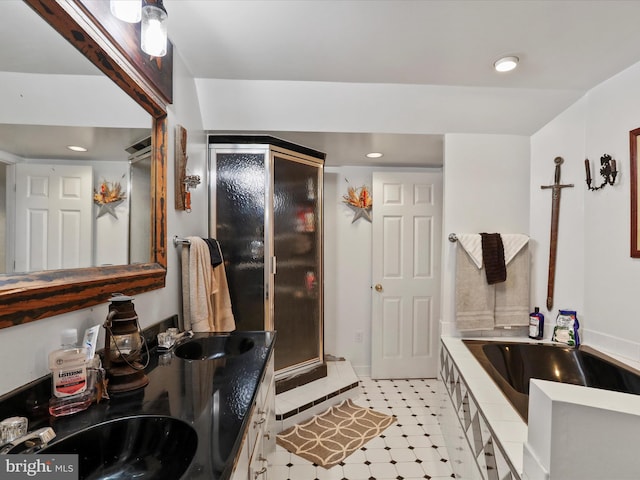 bathroom featuring shower with separate bathtub and vanity