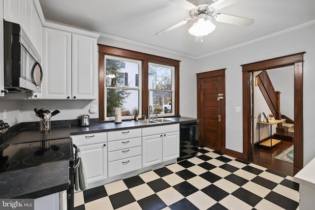 kitchen featuring ornamental molding, black appliances, white cabinetry, and sink