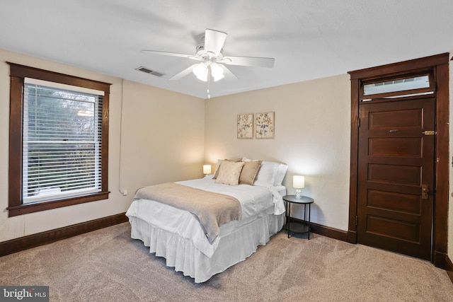 bedroom with ceiling fan and carpet floors