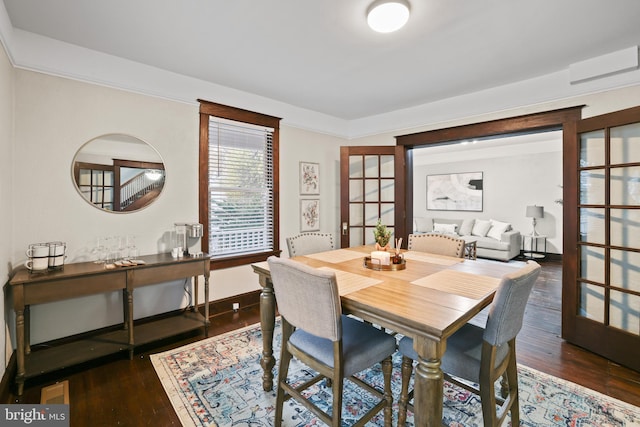 dining space with french doors and dark hardwood / wood-style flooring