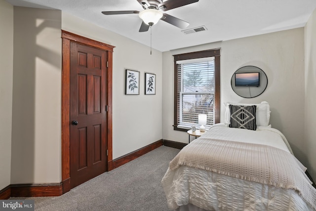 carpeted bedroom with ceiling fan