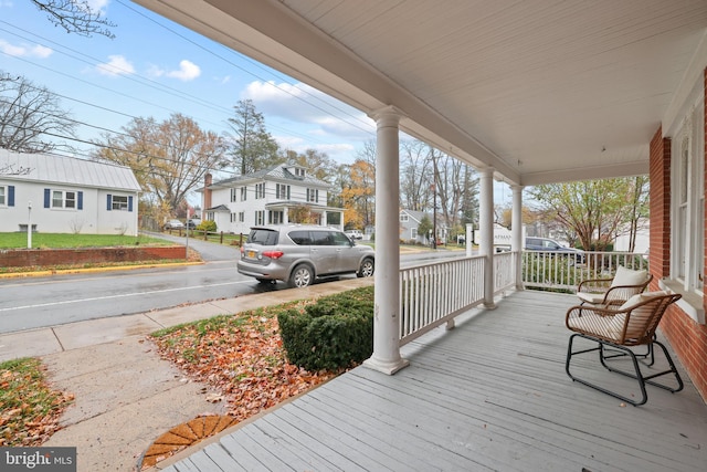 wooden terrace with a porch