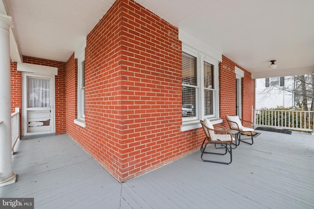 wooden terrace with a porch