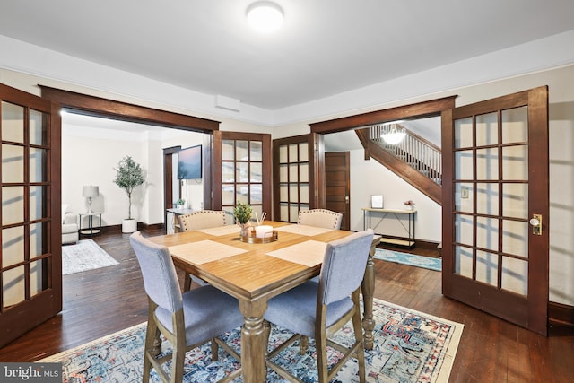 dining room with dark wood-type flooring and french doors