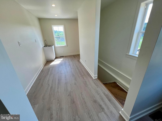 hall with light wood-type flooring