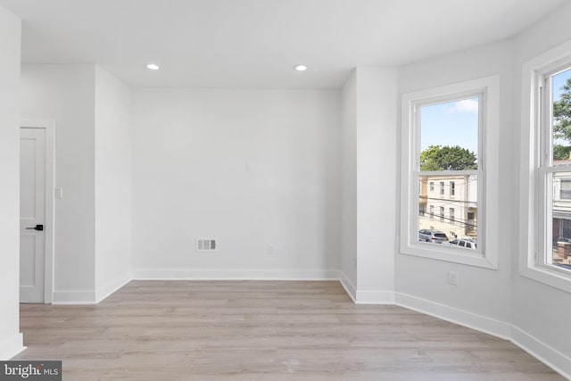 spare room with light wood-type flooring