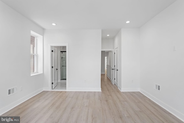 unfurnished room featuring light hardwood / wood-style floors