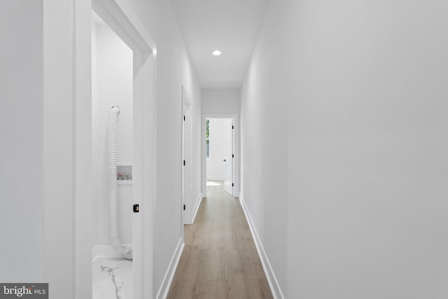 corridor featuring light hardwood / wood-style flooring