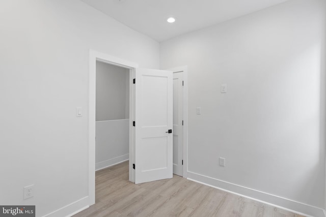 spare room with light hardwood / wood-style floors