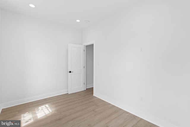 spare room featuring light hardwood / wood-style flooring