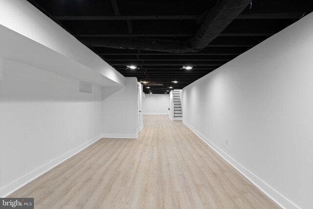 basement featuring light wood-type flooring