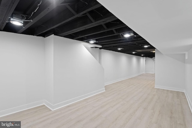 basement featuring light hardwood / wood-style flooring