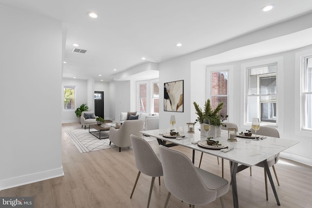 dining space with light wood-type flooring