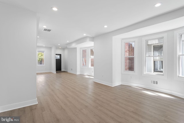 unfurnished living room with light hardwood / wood-style flooring