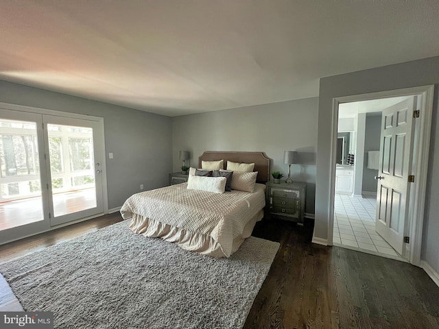 bedroom with baseboards, dark wood-type flooring, and access to outside