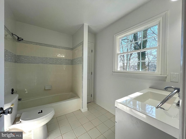 full bath featuring vanity, baseboards, tile patterned flooring, bathing tub / shower combination, and toilet