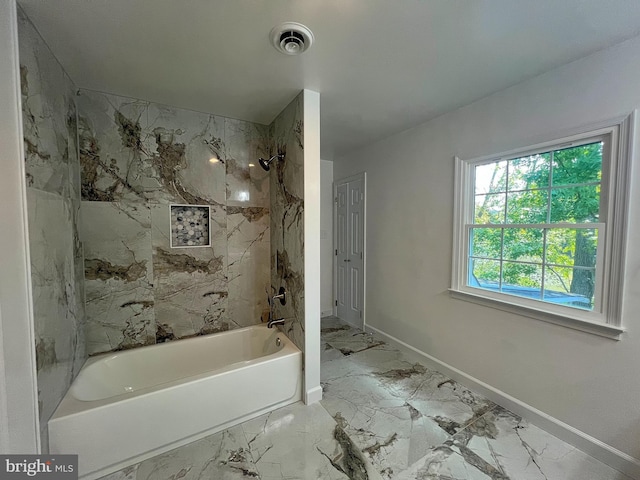 full bathroom featuring visible vents, baseboards, marble finish floor, and shower / bathtub combination