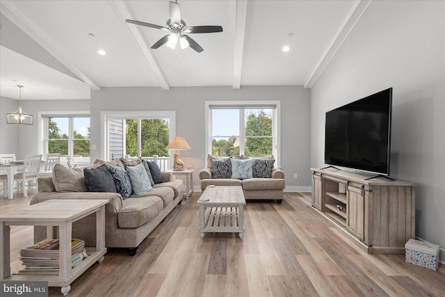 living area with baseboards, lofted ceiling with beams, recessed lighting, light wood-style floors, and ceiling fan with notable chandelier