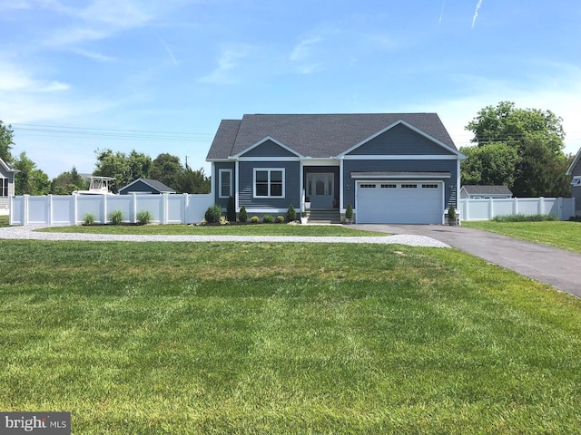 view of front facade featuring a front yard and a garage