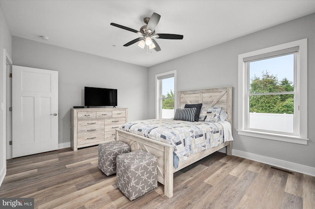 bedroom featuring hardwood / wood-style floors and ceiling fan