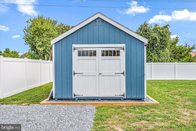 view of outbuilding with a lawn