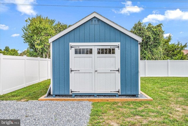 view of shed with a fenced backyard