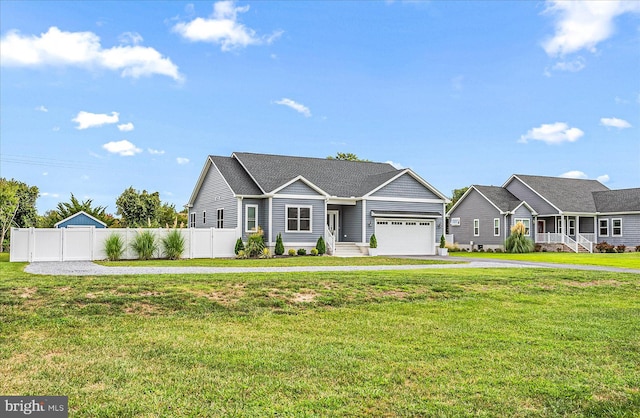 ranch-style house with a garage, driveway, a front lawn, and fence