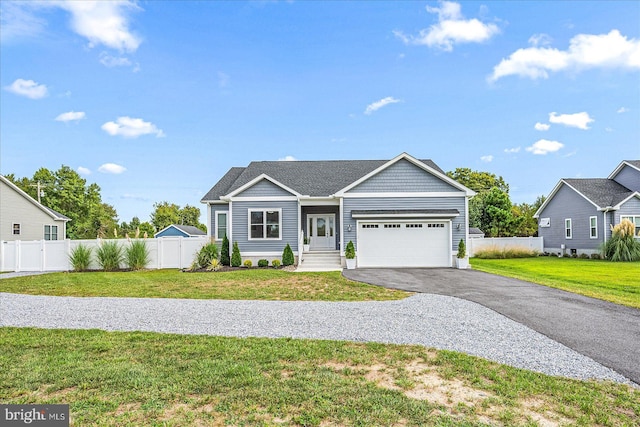 single story home featuring driveway, an attached garage, a front lawn, and fence