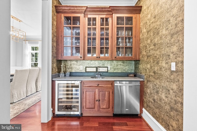 bar with beverage cooler, crown molding, dark hardwood / wood-style flooring, and stainless steel dishwasher