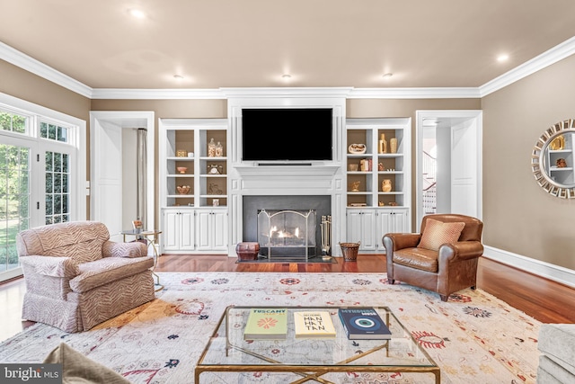 living room featuring ornamental molding and hardwood / wood-style flooring