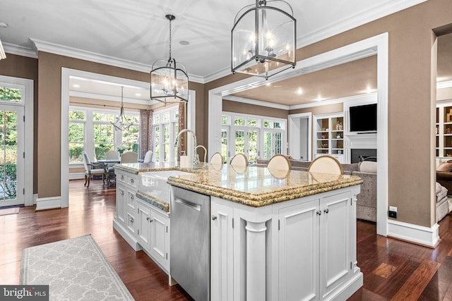 kitchen featuring a kitchen island with sink, dark hardwood / wood-style floors, white cabinetry, and stainless steel dishwasher