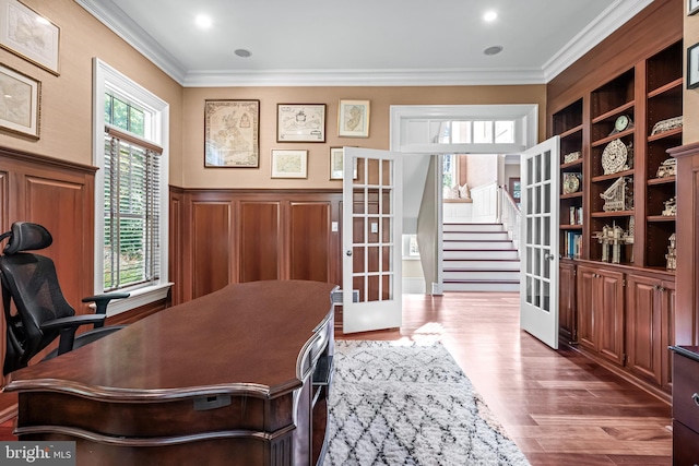 office space with crown molding, french doors, and dark hardwood / wood-style flooring