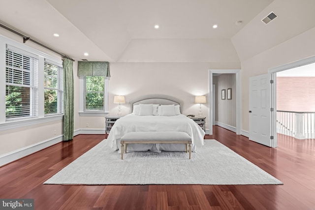 bedroom featuring dark hardwood / wood-style floors and vaulted ceiling