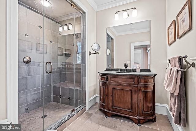 bathroom featuring vanity, crown molding, tile patterned flooring, and a shower with door