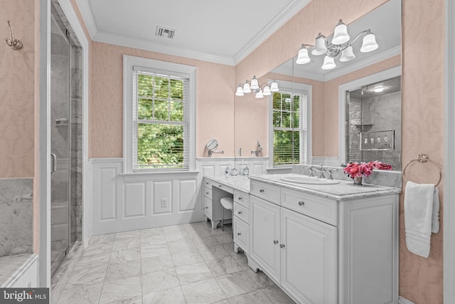 bathroom with a notable chandelier, vanity, ornamental molding, and a shower with door