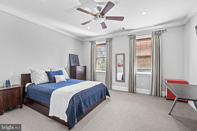 bedroom featuring light carpet, crown molding, and ceiling fan