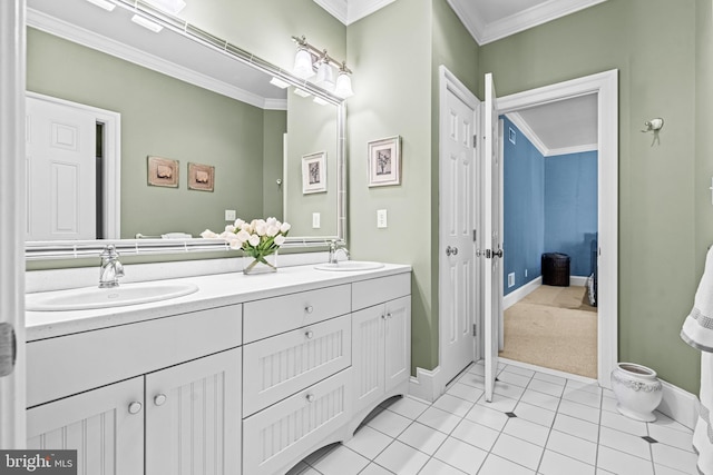 bathroom featuring ornamental molding, tile patterned flooring, and vanity