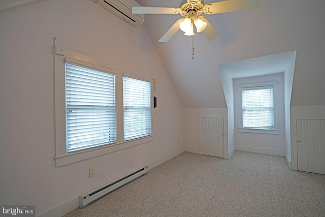 bonus room featuring a wall unit AC, vaulted ceiling, light colored carpet, baseboard heating, and ceiling fan